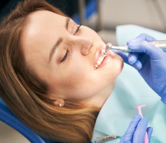 Woman having her teeth professionally cleaned