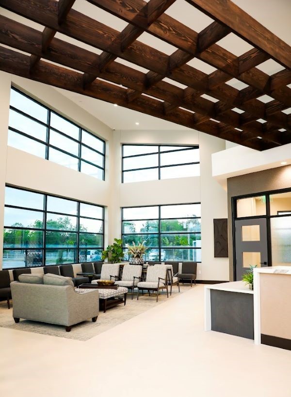 Dental office waiting area with high ceilings