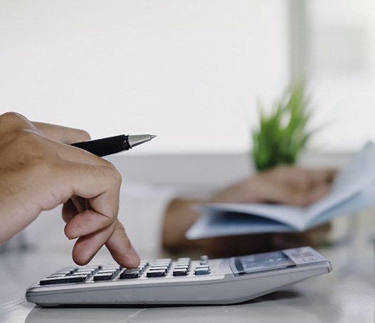 Man using a calculator